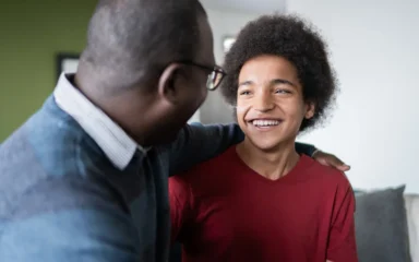 dad and son looking each other