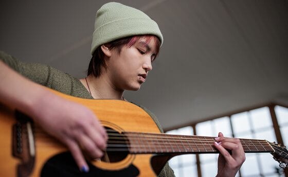 Stuent playing the guitar